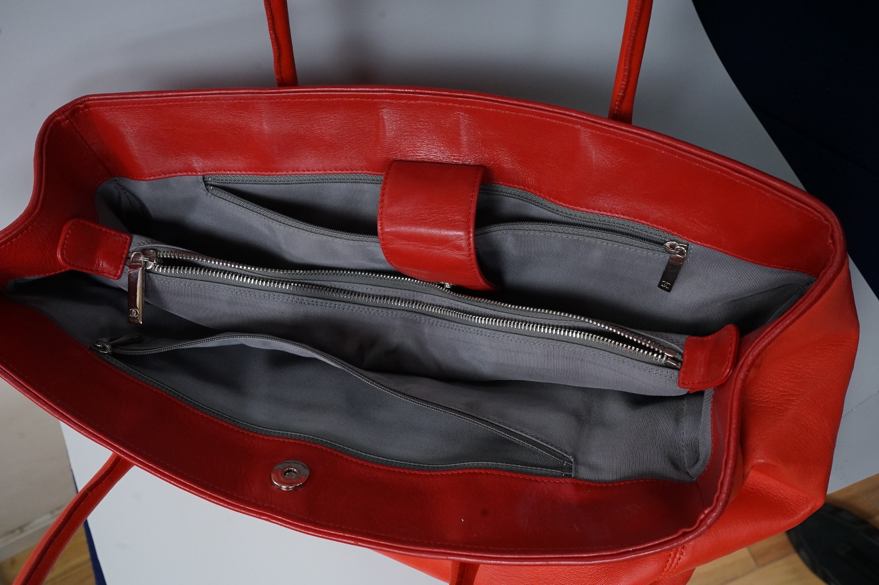 A Chanel red leather Executive Cerf tote bag with silver hardware, with original receipt and dust cover, 41cm wide, Provenance: Purchased by the vendor in Dubai, Chanel